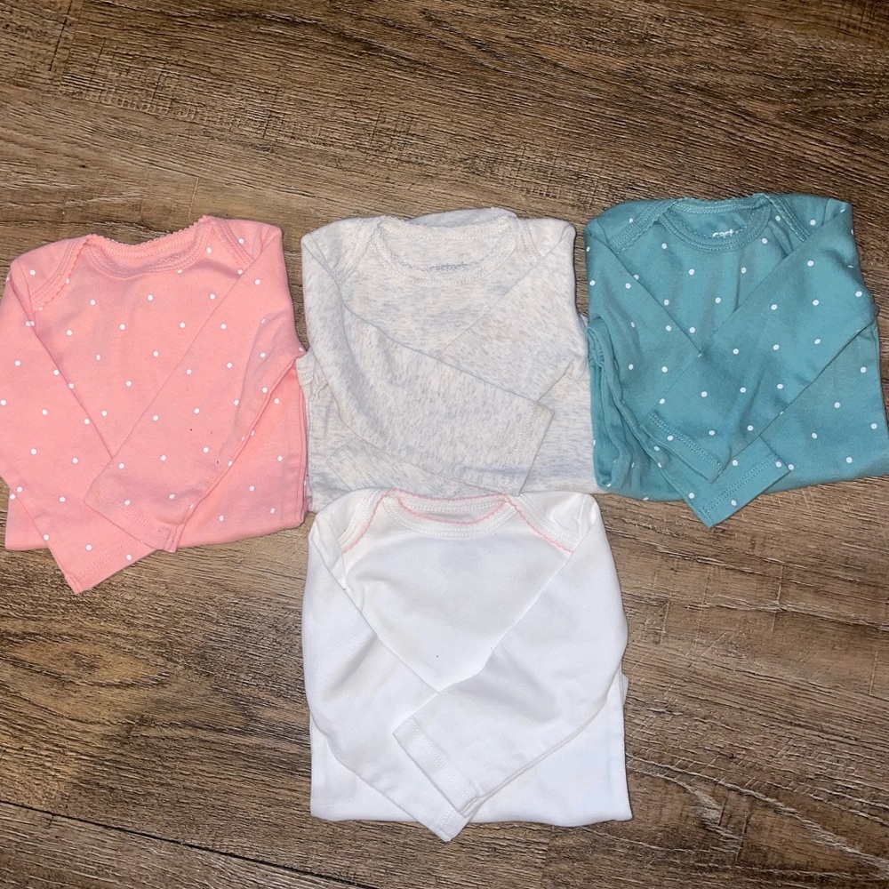 Brand new Carter’s long sleeve onesies